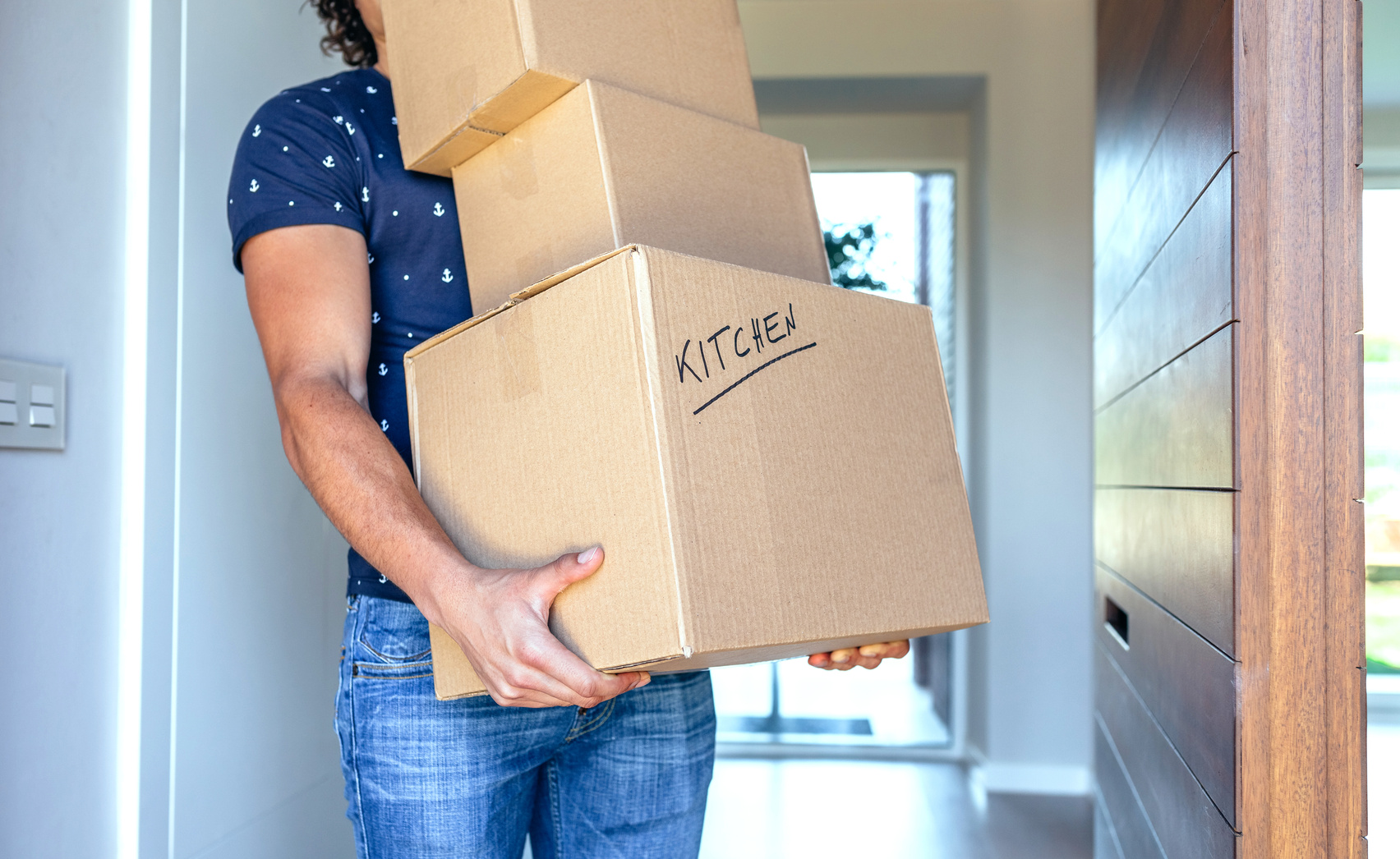 Man Carrying Moving Boxes